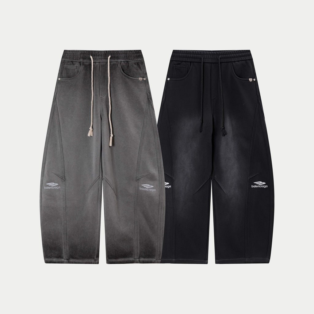 Gray and black drawstring waist pants with matching pocket and logo accents