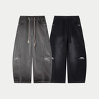 Gray and black drawstring waist pants with matching pocket and logo accents