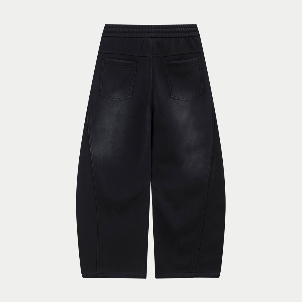 Black drawstring waist pants with front slash pockets and logo at side