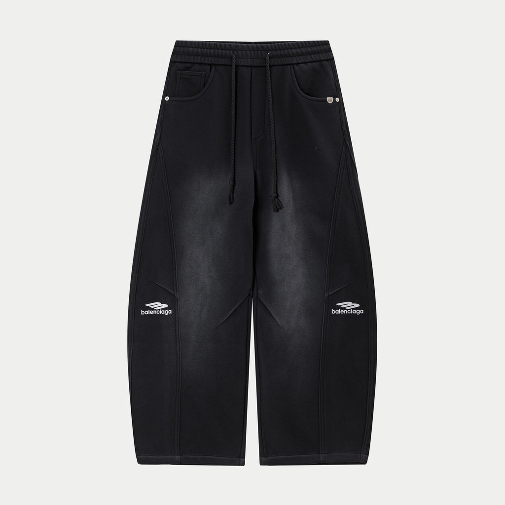 Black drawstring waist pants with side pockets and logo at hem cuffs