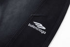Black pants with stitched BALENCIAGA logo on the side seam