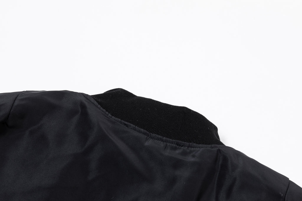 Black bomber jacket with ribbed collar and gathered shoulder sleeve detail