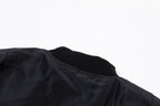 Black bomber jacket with ribbed collar and gathered shoulder sleeve detail