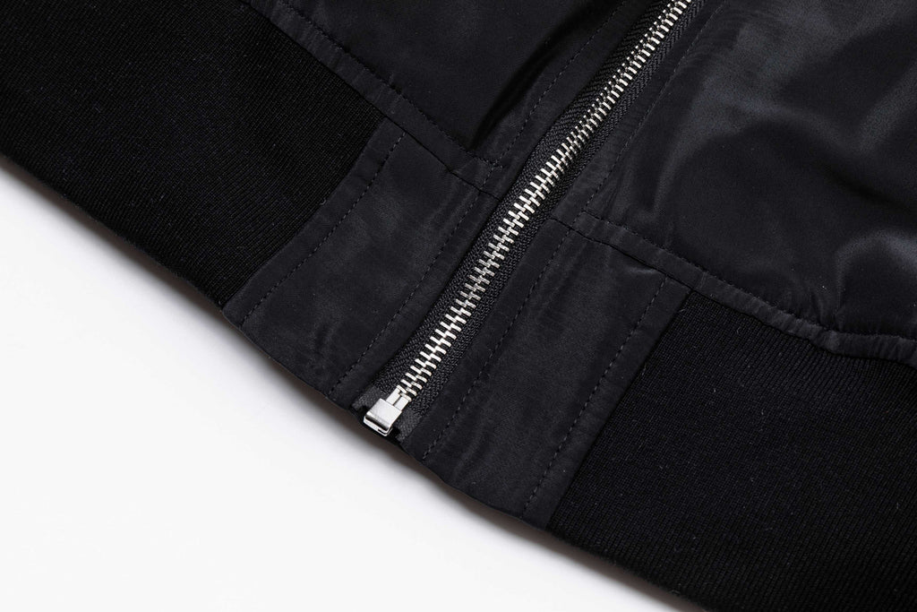 Black long pants leg with front zipper and ribbed cuff