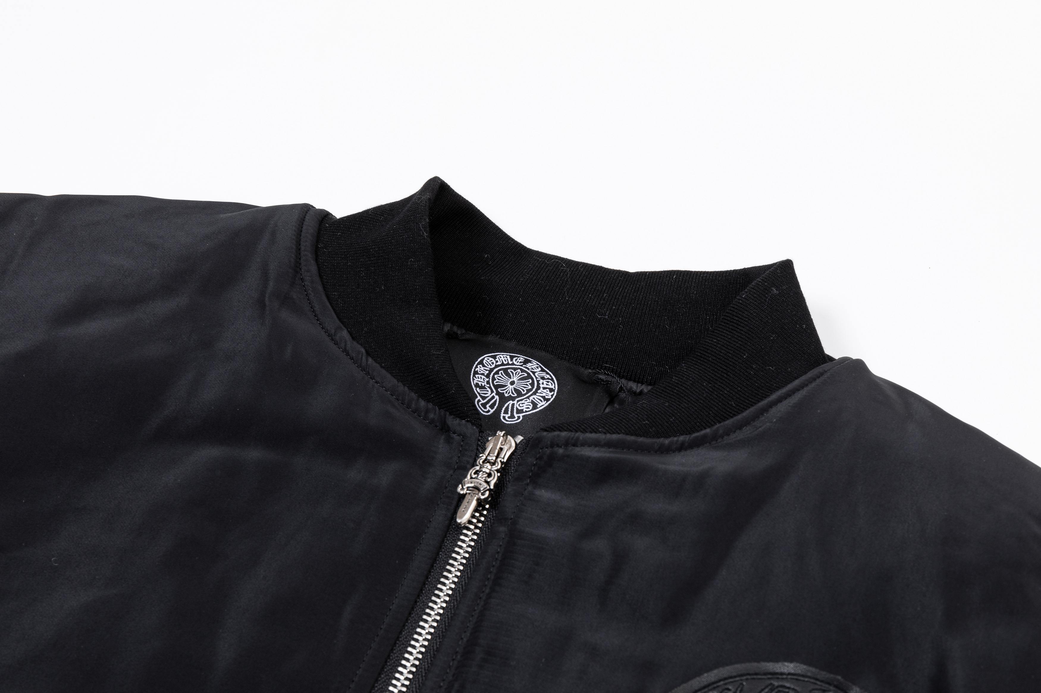 Black bomber jacket neckline with zip closure and small chest emblem