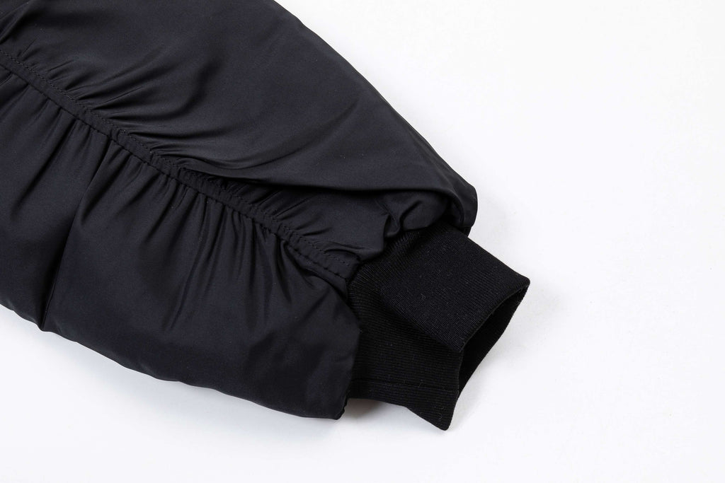 Black long pants with elastic waistband and gathered cuffs