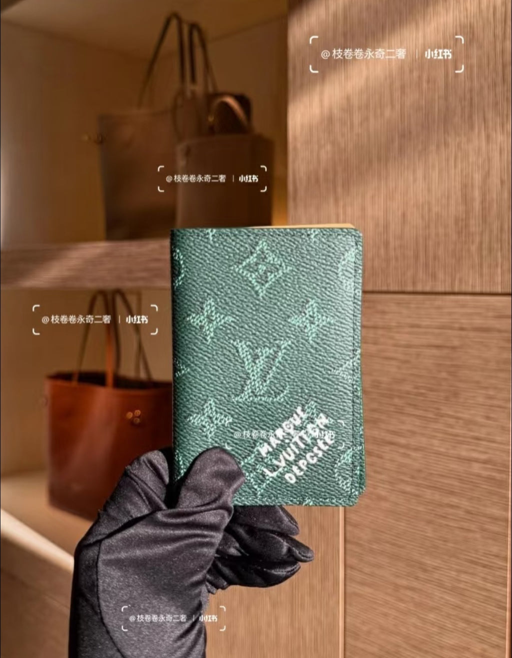 Louis Vuitton small pouch in green monogram, held by black fabric glove