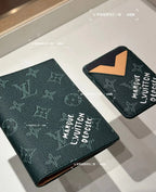 Pair of Louis Vuitton small pouches in dark green monogram with tan lining