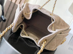 Chanel light gray flap bag open top with fabric lining and gold chain