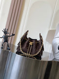 Chanel bag in dark brown suede with gold chain strap and CC turn-lock