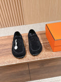 Hermes unisex black suede loafers with buckle strap and front logo emblem