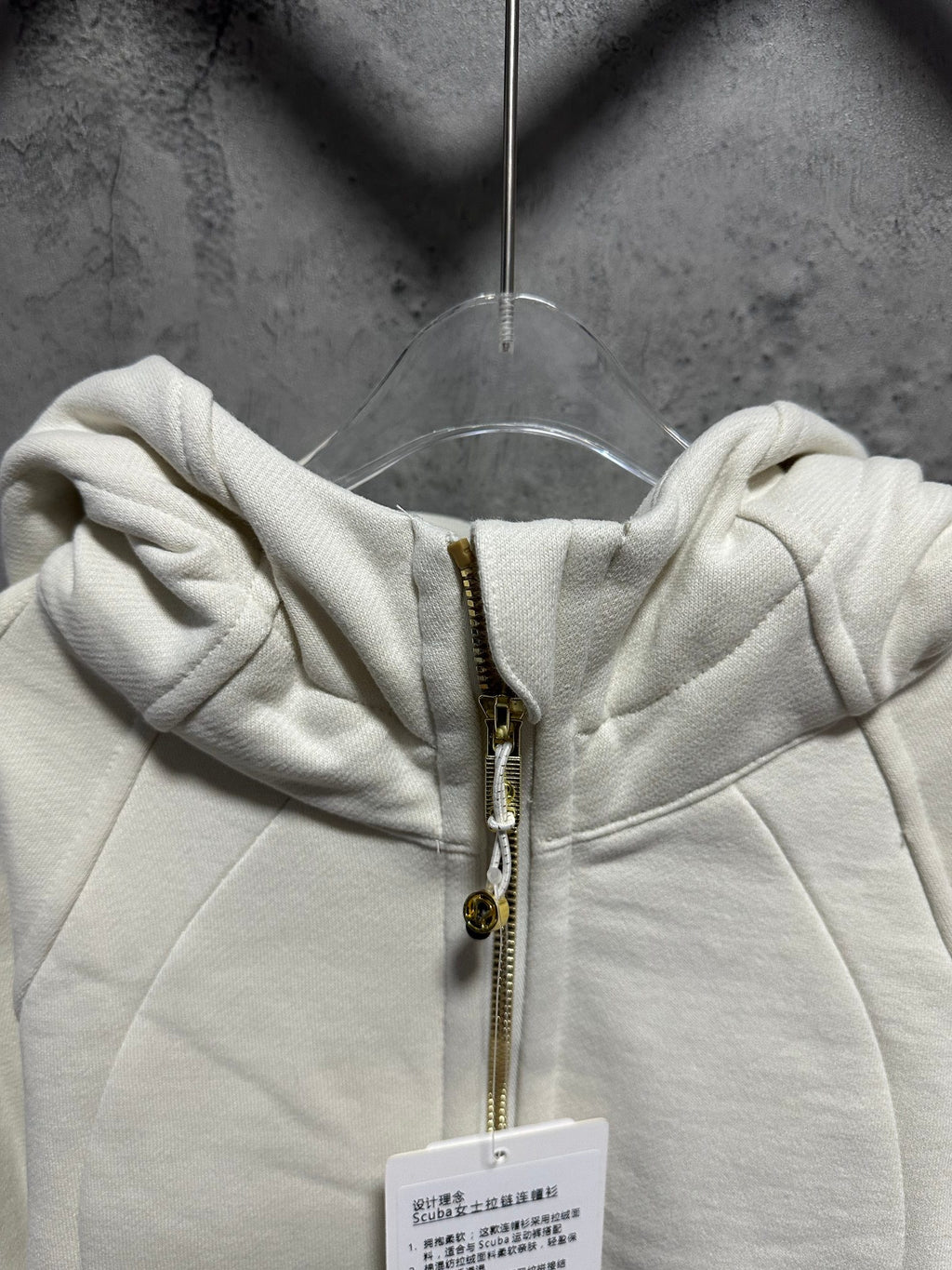Ralph Lauren zip-up hoodie hood with gold zipper, drawstring, and size tag