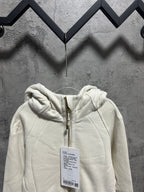 Cream zip-up hoodie with hood and front pouch pocket, hanging tag
