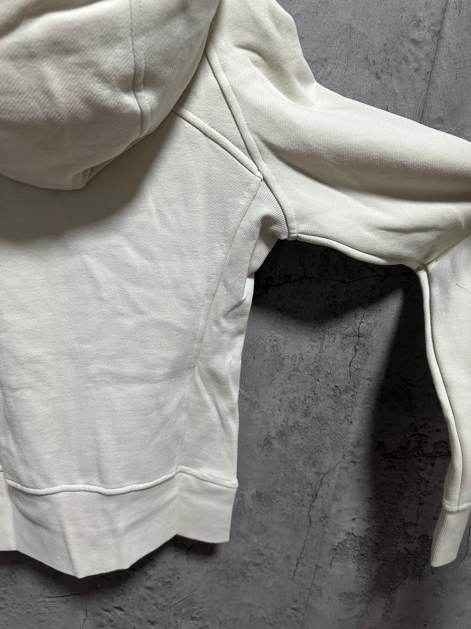 Ralph Lauren light cream hoodie sleeve and hood edge, with side pocket opening
