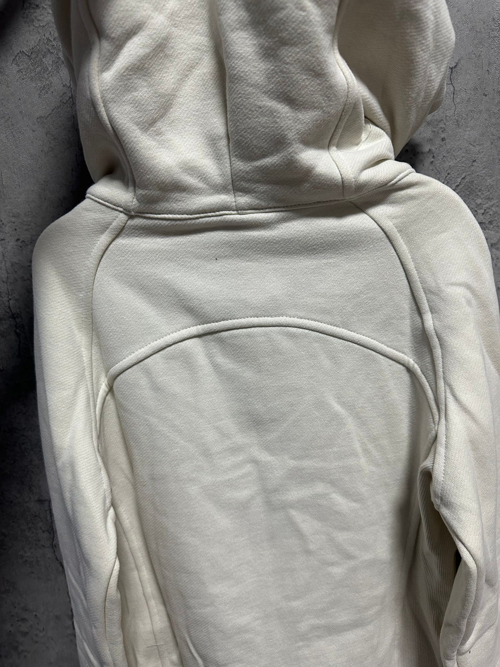 Ralph Lauren light cream zip-up hoodie back view with hood and curved seam details