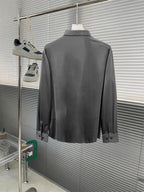Versace button-up dress shirt, grey back view on hanger.