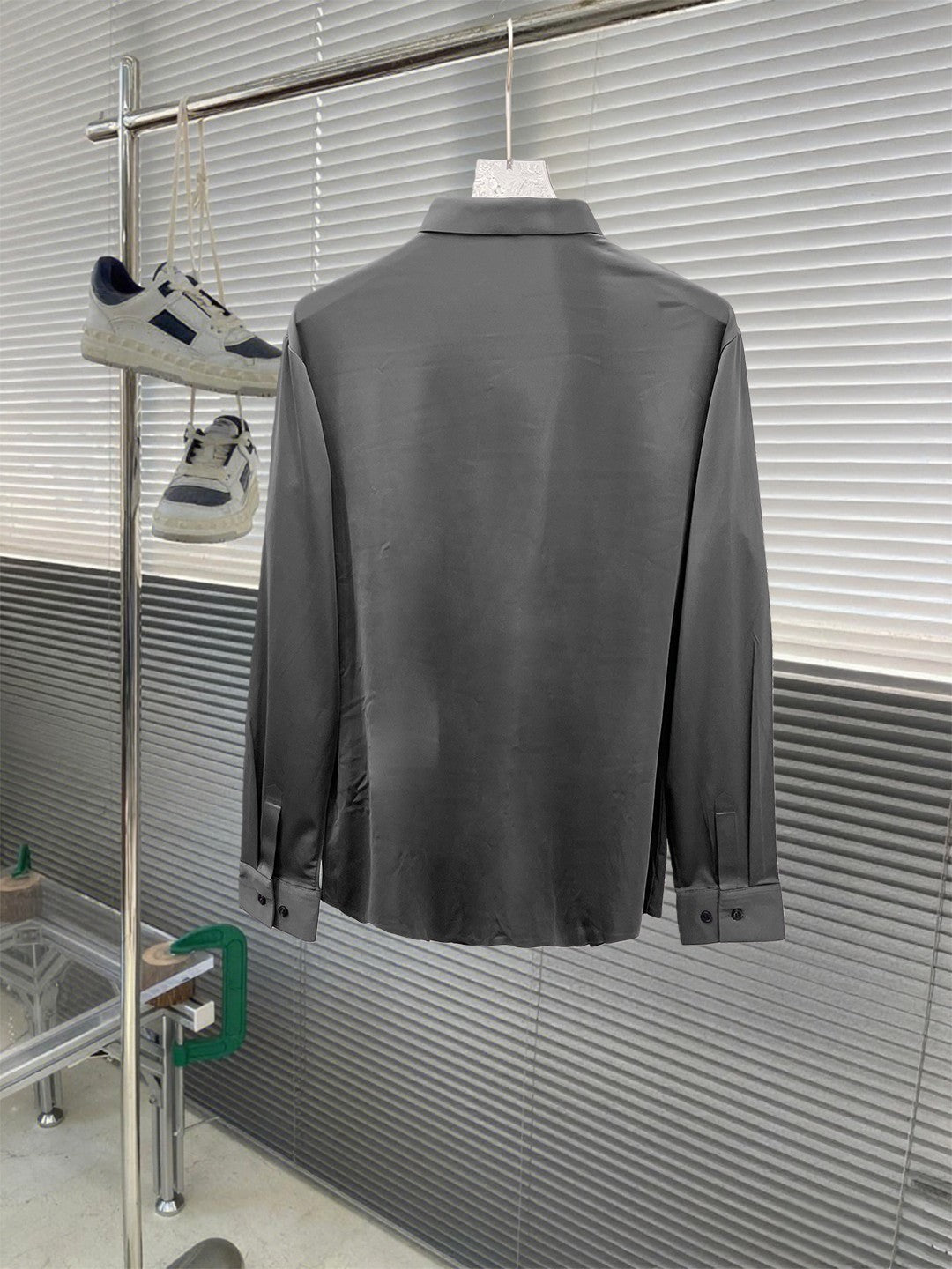 Versace button-up dress shirt, grey back view on hanger.