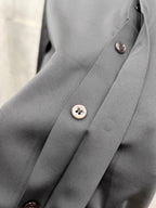 Versace button placket with metal buttons, grey dress shirt.