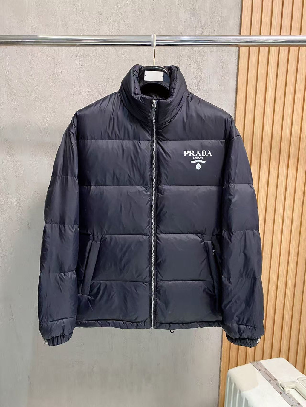 Prada puffer jacket with front zipper and stand collar, dark outerwear shell