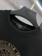 Versace crewneck collar detail in dark fabric with inner neck label