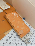 Small Louis Vuitton monogram bag with zip closure and side keyring hardware