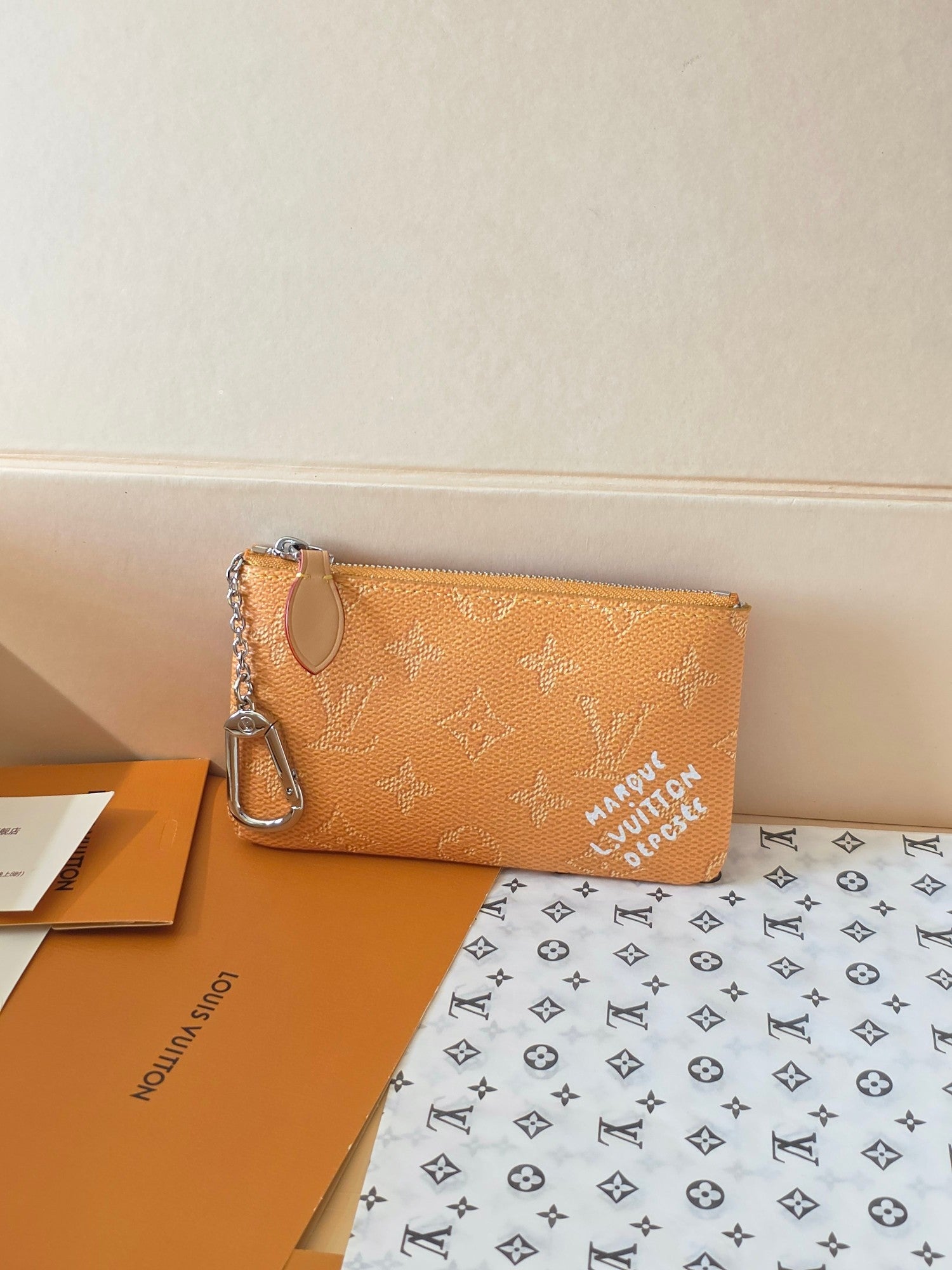 Small Louis Vuitton monogram toiletry bag with zip top and metal keyring loop