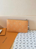 Louis Vuitton monogram zip pouch, tan-brown rectangular shape with silver zipper hardware
