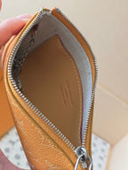 Small Louis Vuitton monogram bag open view with zip lining and interior branding