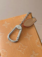 Small Louis Vuitton monogram bag with silver D-ring and chain strap detail