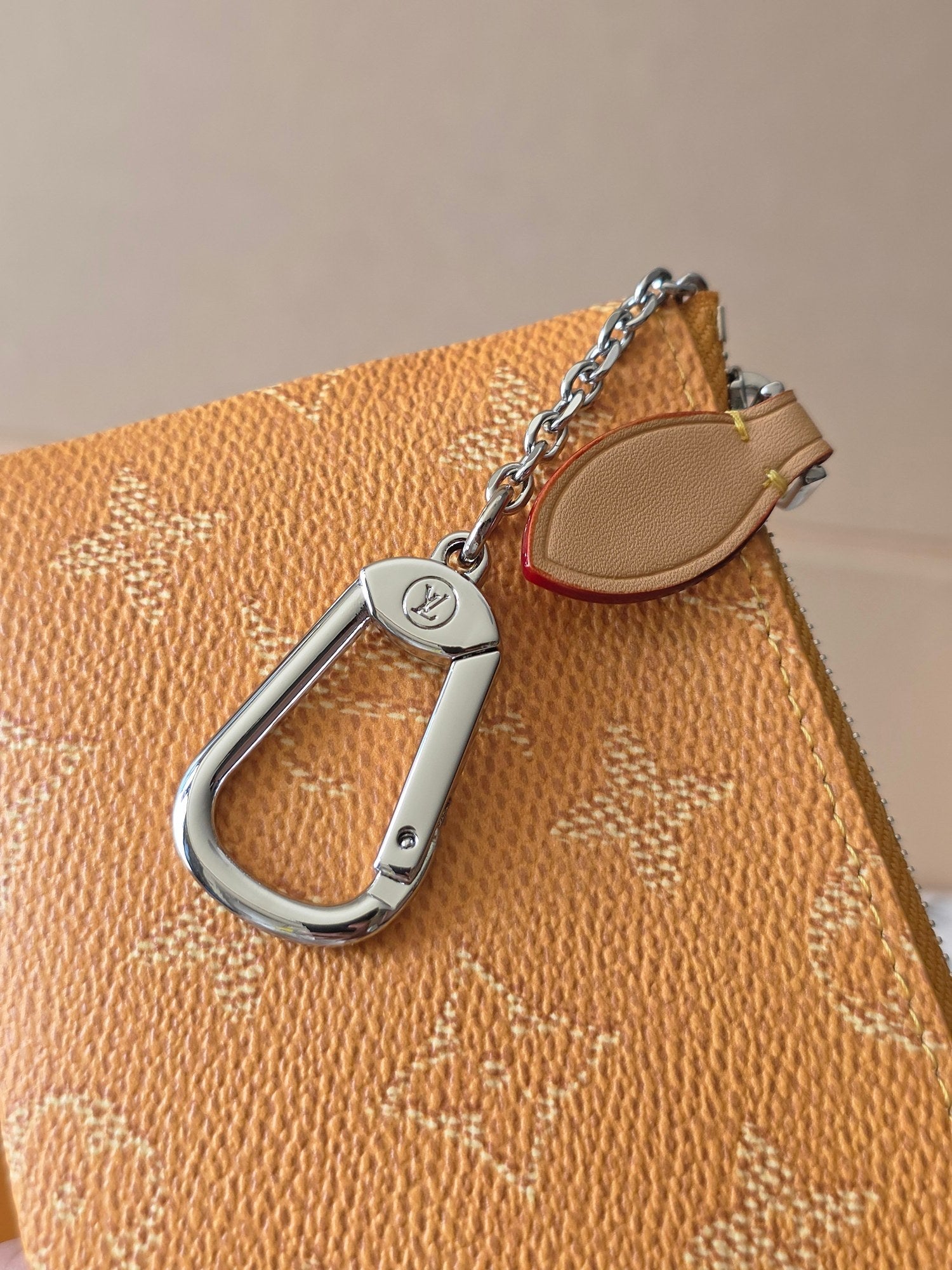 Small Louis Vuitton monogram bag with silver D-ring and chain strap detail