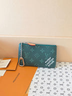 Louis Vuitton small bag in teal monogram canvas with zipper and detachable chain strap