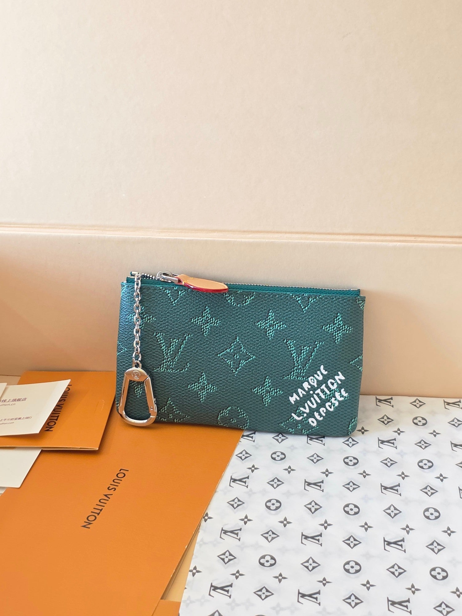 Louis Vuitton small bag in teal monogram canvas with zipper and detachable chain strap