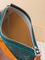 Louis Vuitton small bag interior view with beige lining and silver zipper detail
