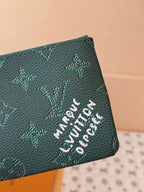 Louis Vuitton small bag with teal monogram canvas and white embroidered-style lettering