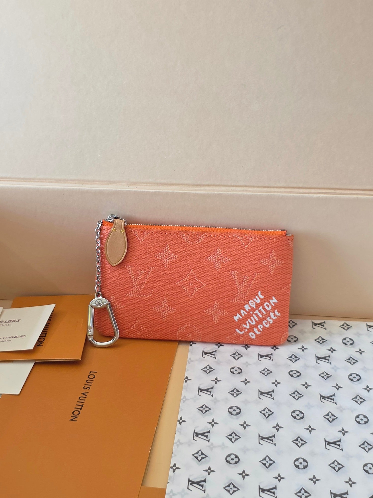 Orange monogram small Louis Vuitton zip pouch with silver keychain ring