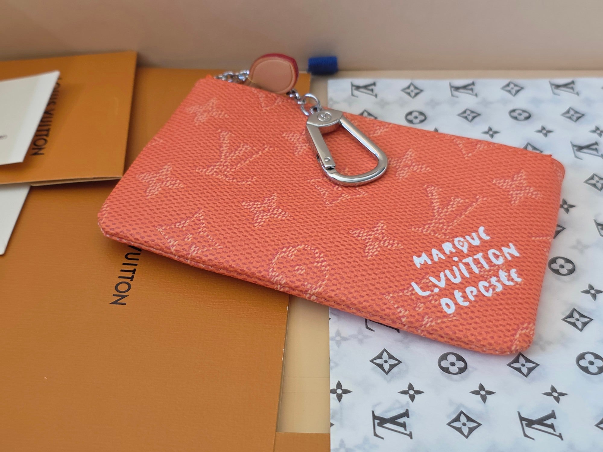 Orange monogram small zip pouch with front logo print and silver carabiner