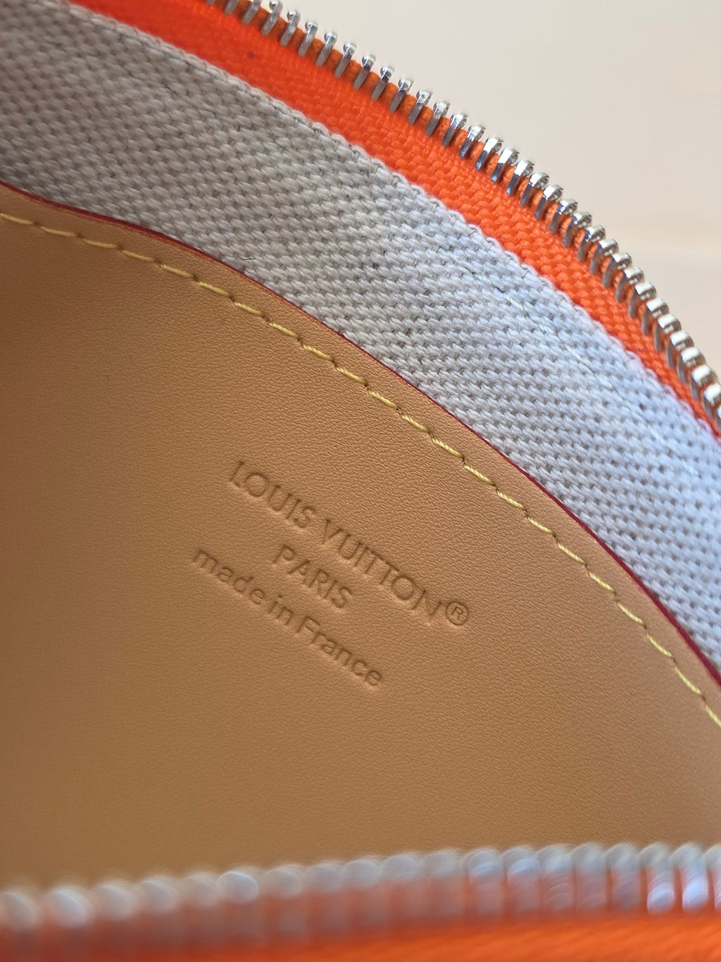Beige interior lining with Louis Vuitton Paris logo stamp