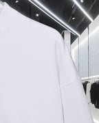 White Moncler sweatshirt, close view of shoulder and sleeve seam