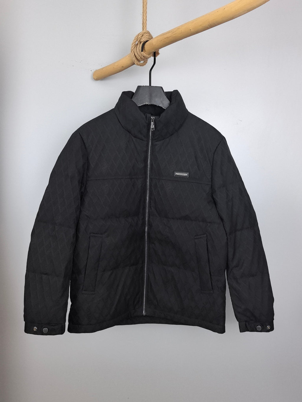 Black Burberry quilted jacket with full-zip front and stand collar