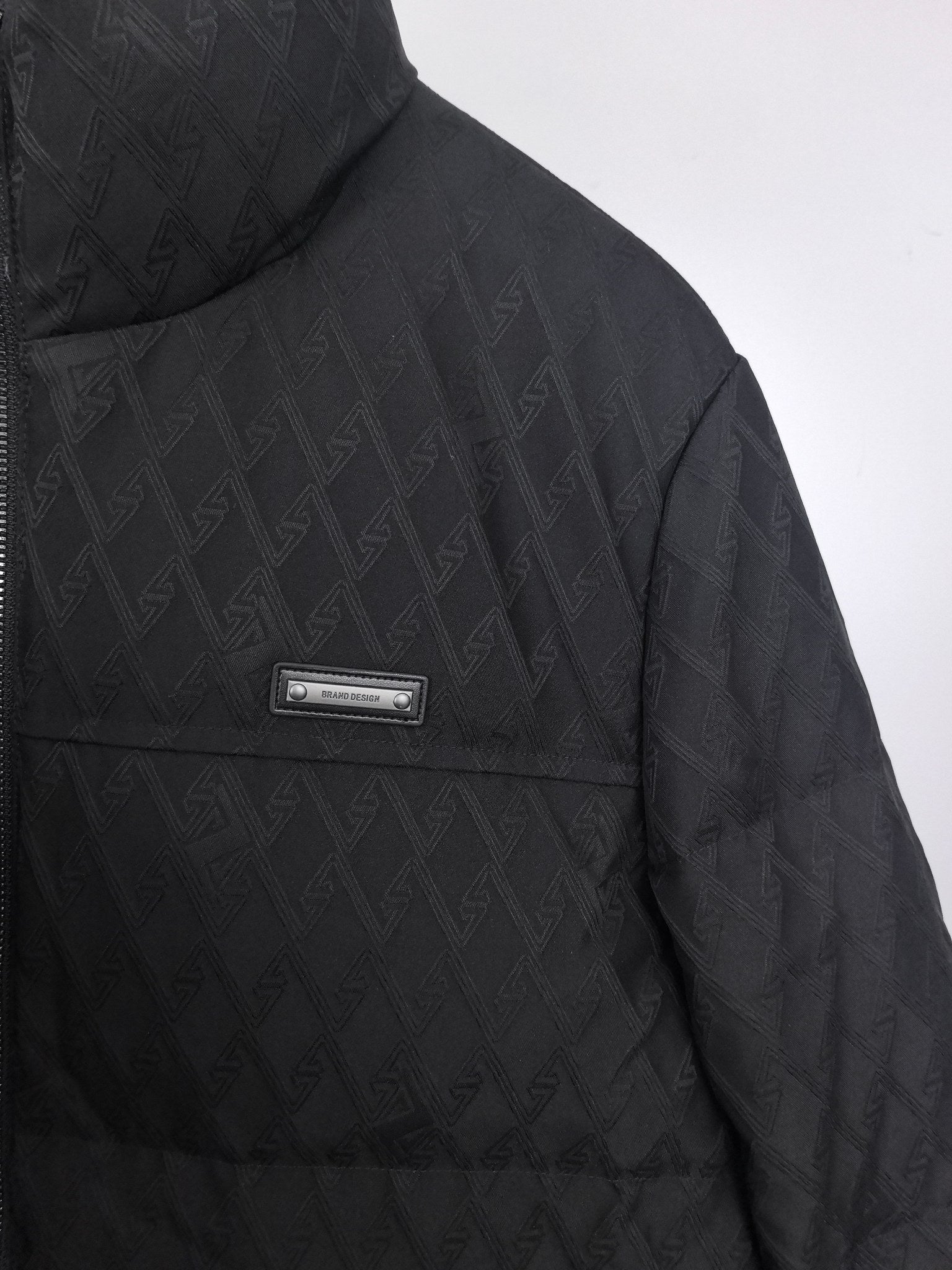 Black Burberry quilted jacket side view with chest logo patch