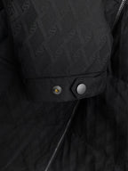Black quilted jacket pocket and snap-button placket detail
