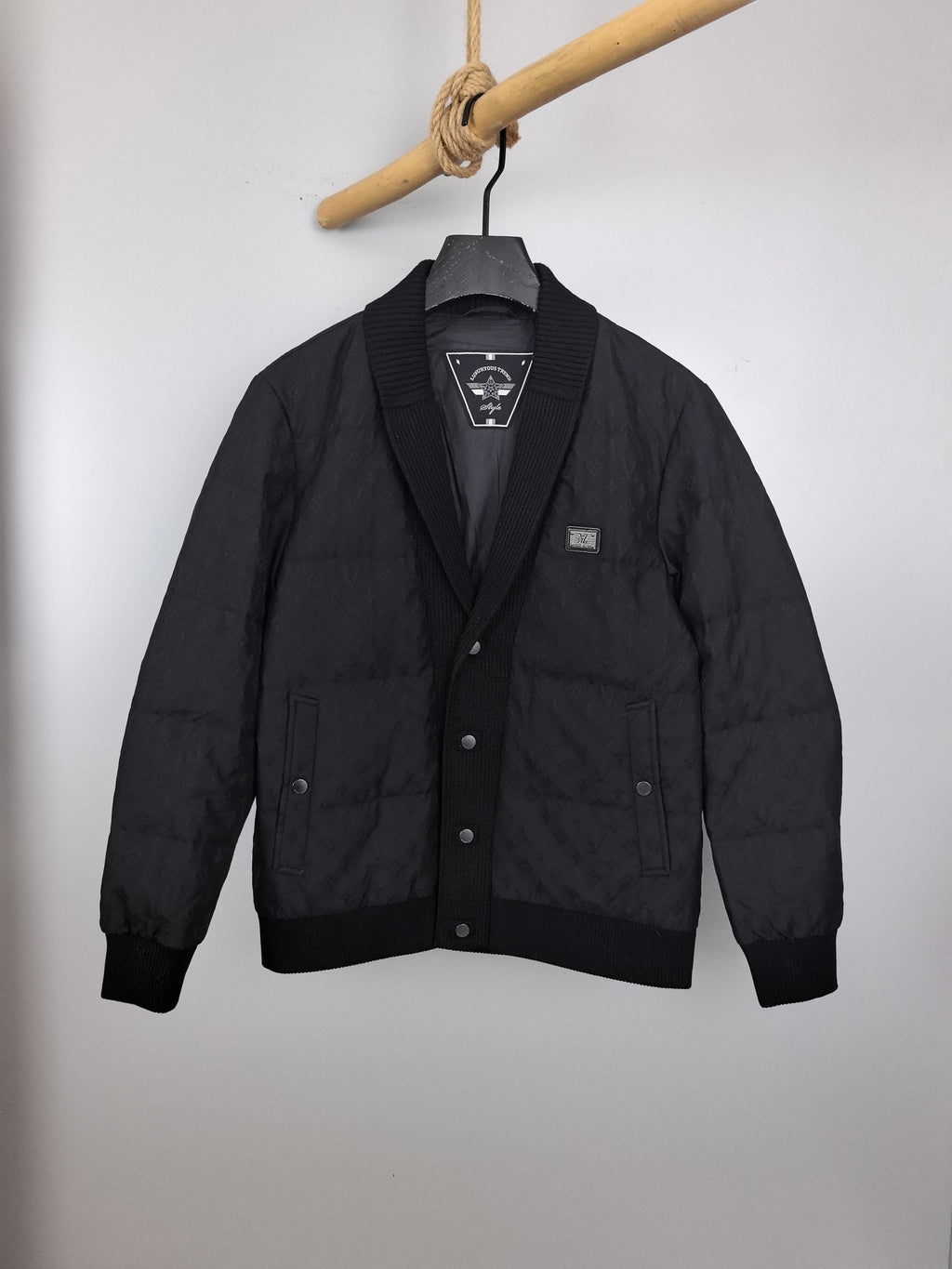 Louis Vuitton black quilted jacket with button front and ribbed knit collar