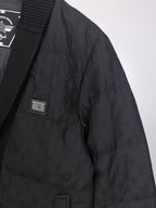 Louis Vuitton black quilted jacket side with small logo patch