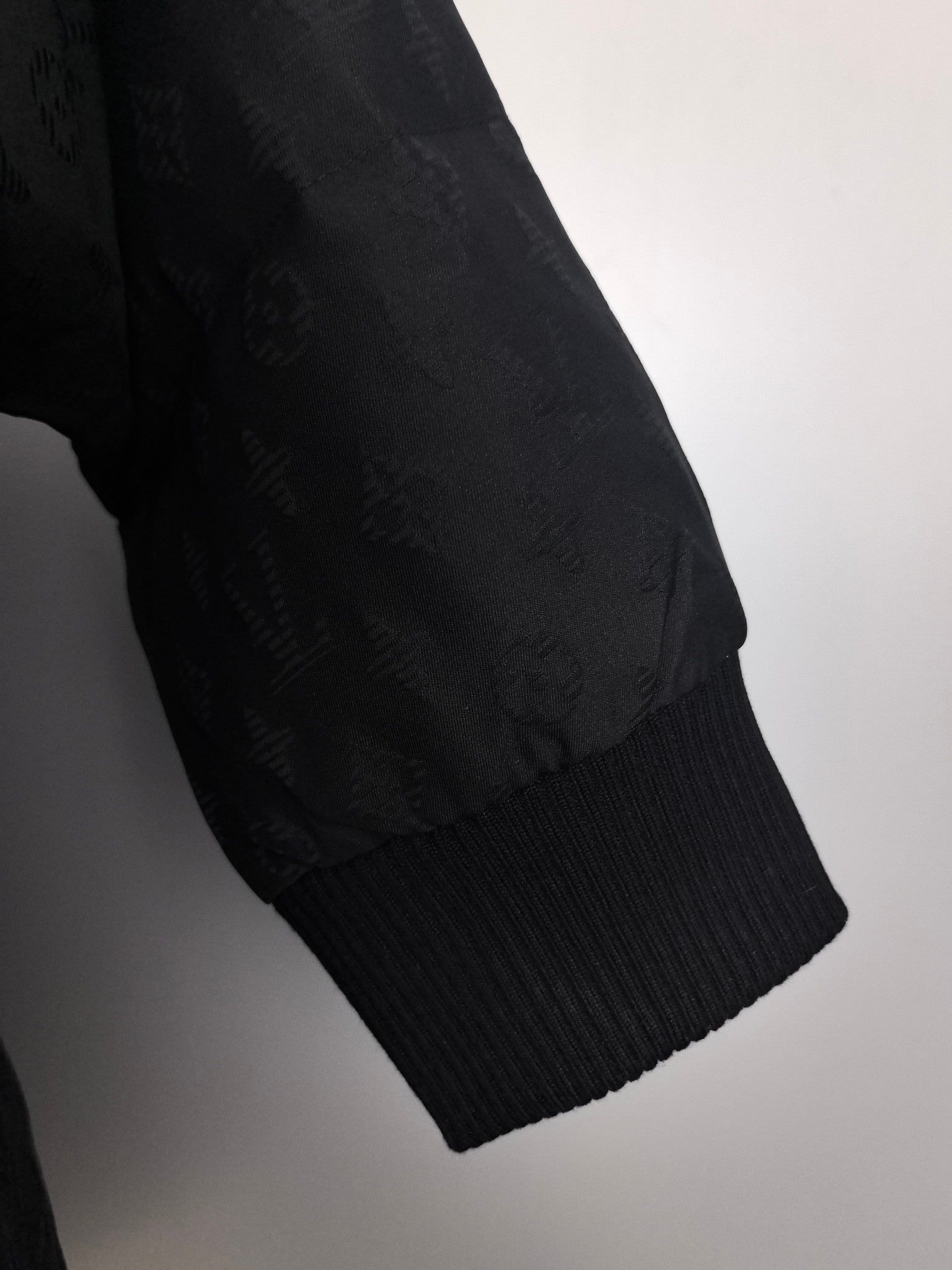 Louis Vuitton black quilted jacket sleeve cuff with ribbed knit trim