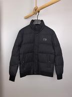 Black long-sleeve puffer jacket with full zipper and small chest logo patch