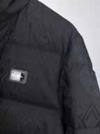 Black puffer jacket sleeve and chest area with logo patch