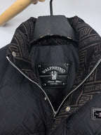 Black puffer jacket hood lining detail with Valentino brand label inside