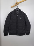 Prada puffer jacket with stand collar, front button placket, and chest logo patch