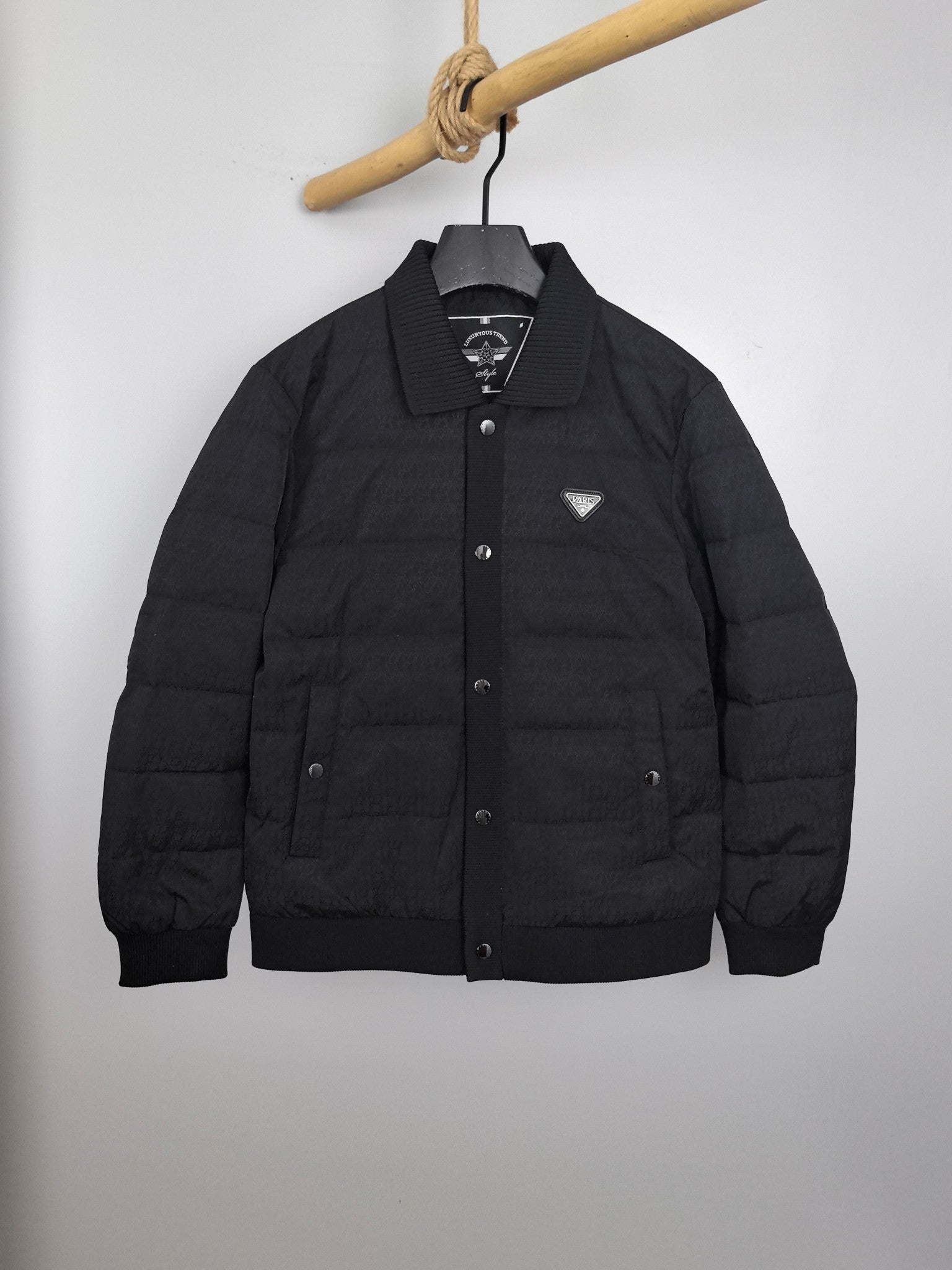 Prada puffer jacket with stand collar, front button placket, and chest logo patch