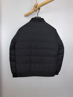 Prada puffer jacket back view with stand collar and quilted horizontal stitching